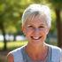 Portrait of Maria G., 50, looking confident and happy